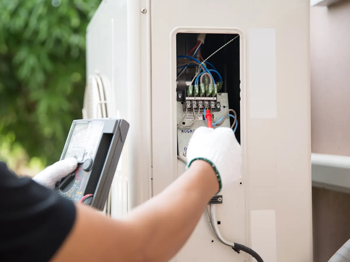 technician repairing a heat pump in toronto home